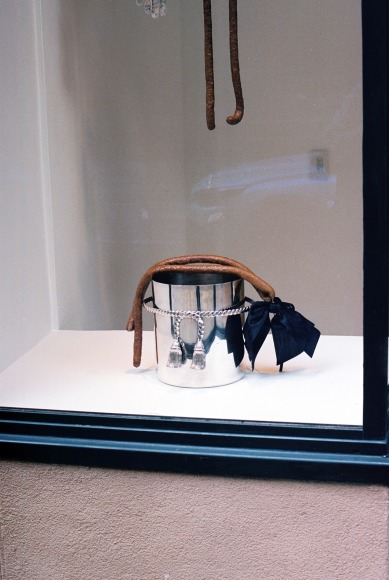 Exterior view of ribboned saucissons draped over Maria Pergay&#039;s&nbsp;Tassel Champagne Bucket, 1957. Photo by Adrianna Glaviano&nbsp;