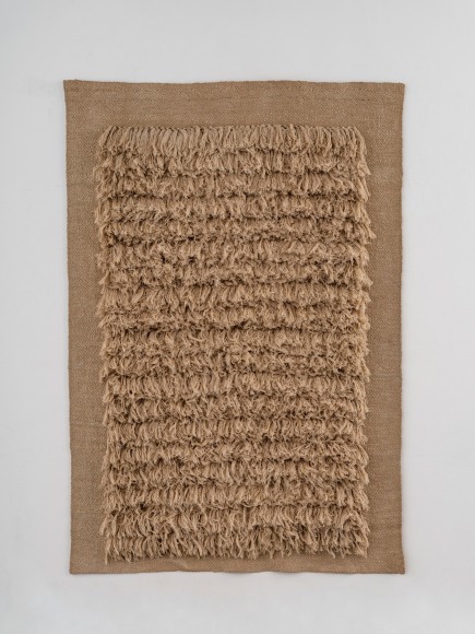 Linen wall hanging with shag like tufting by Sheila Hicks