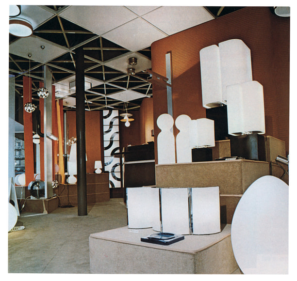 Archival photo of the Verre Lumiere shop featuring various table, floor, and ceiling lamps