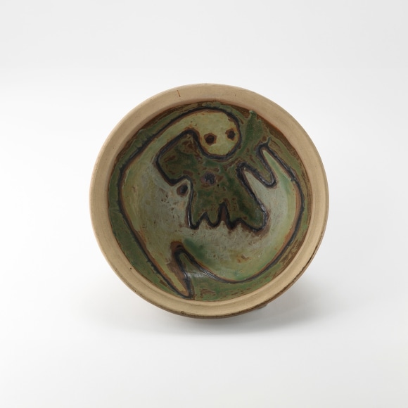 photograph of a dish in an empty room