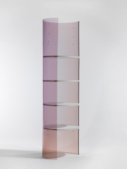 photograph of Laporte bookcase in a blank room, bookcase is rounded