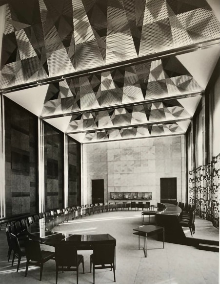 Large room with oval table and chairs