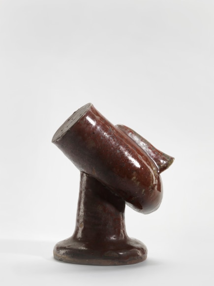 photograph of a anthropomorphic bowl in an empty room