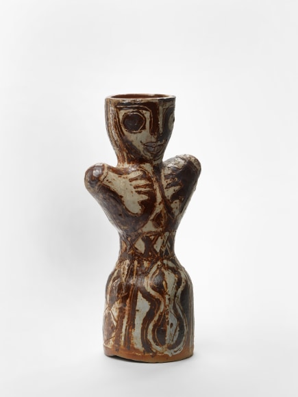 photograph of an anthropomorphic object in an empty room