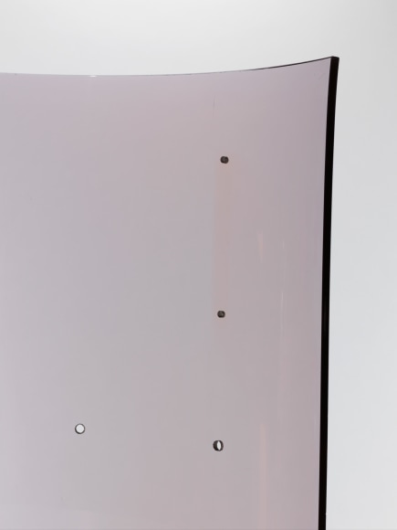 photograph of Laporte bookcase in a blank room, bookcase is rounded