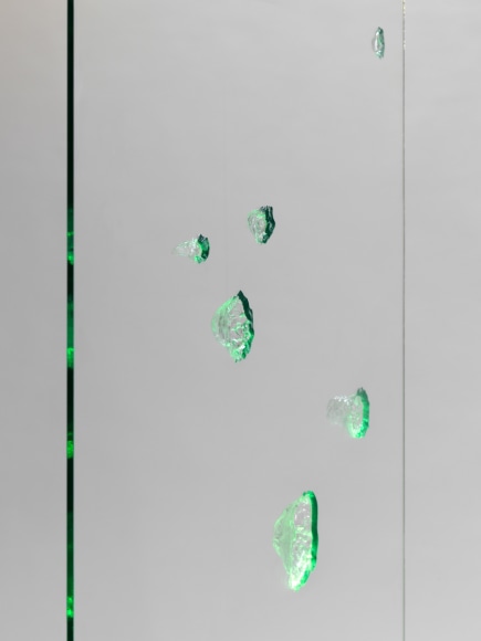 photos of a glass panel with a steel base