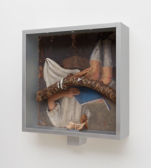 Robert Gober art work of a girl hanging upside down and reading with a branch and aluminum frame.