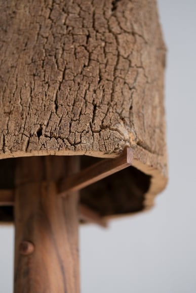 Cork and Oak floor lamp against an empty room turned off.