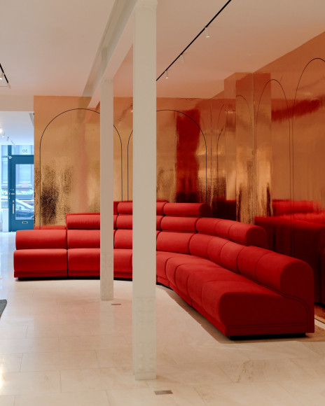 View of Paulin hotel de Ville sofa in the gallery. red upholstery in 10 sections.