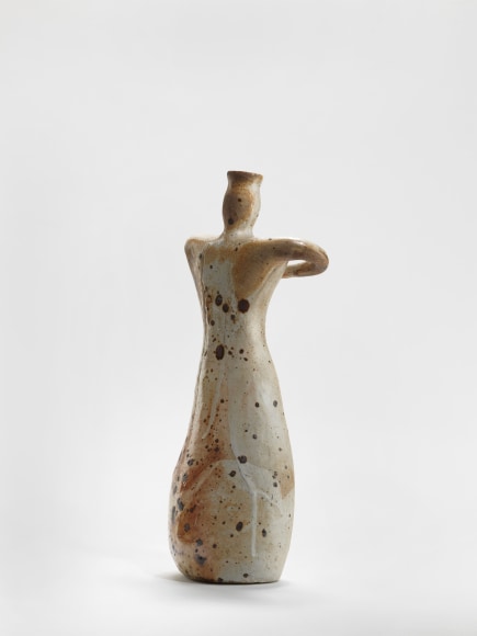 photograph of an anthropomorphic object in an empty room