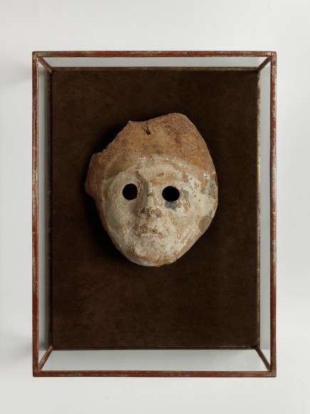 shadow box with a mask inside