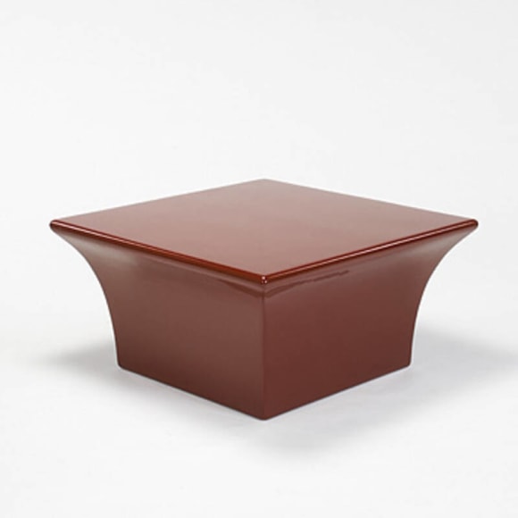 photograph of a low table in an empty room