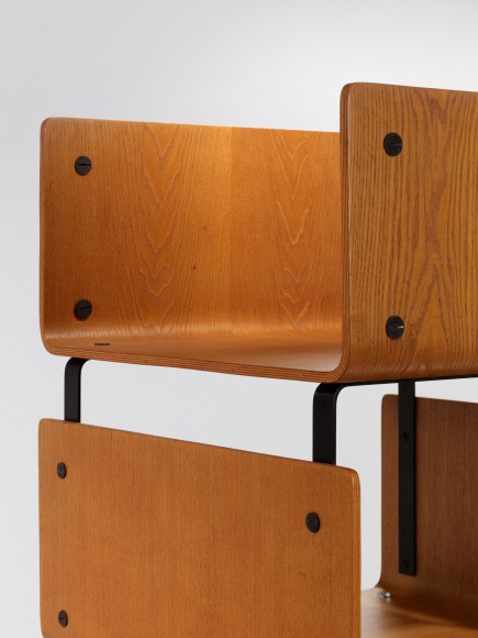 Detail of top wooden shelf on bookcase