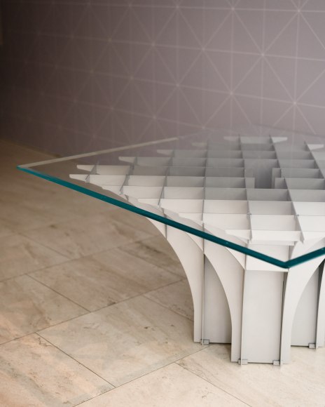 View of Paulin Cathedral Table in the gallery with glass top.