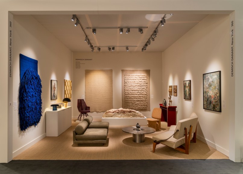 installation image in the booth of a wide angle shot of all the works.