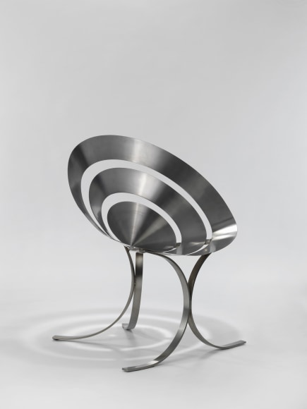 stainless steel chair in an empty room