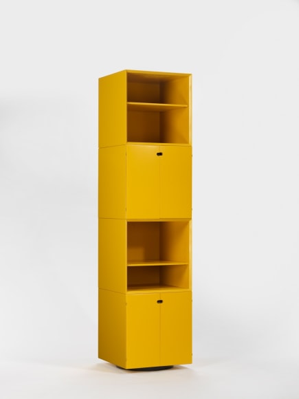photograph of a yellow cabinet in a blank room