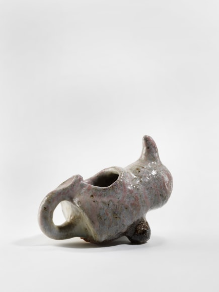 photograph of a zoomorphic rhinoceros dish in an empty room