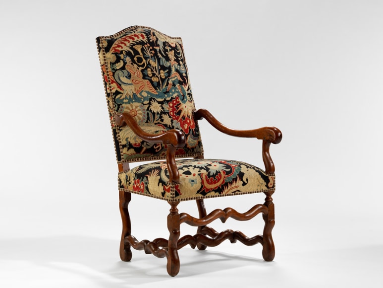 picture of a antique chair in a gray room