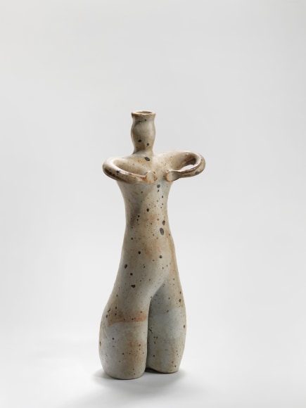 photograph of an anthropomorphic object in an empty room