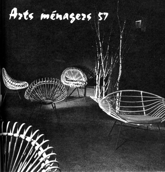 Rattan chairs of various shapes in a dramatic lighting