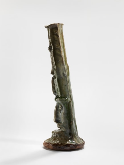 photograph of a cephalomorphic object in an empty room