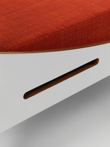 midcentury bed in an empty room