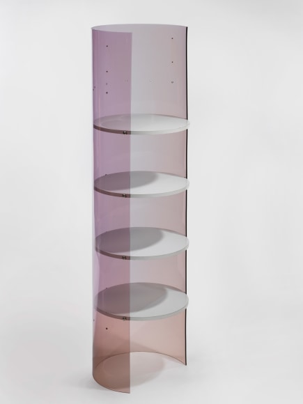 photograph of Laporte bookcase in a blank room, bookcase is rounded