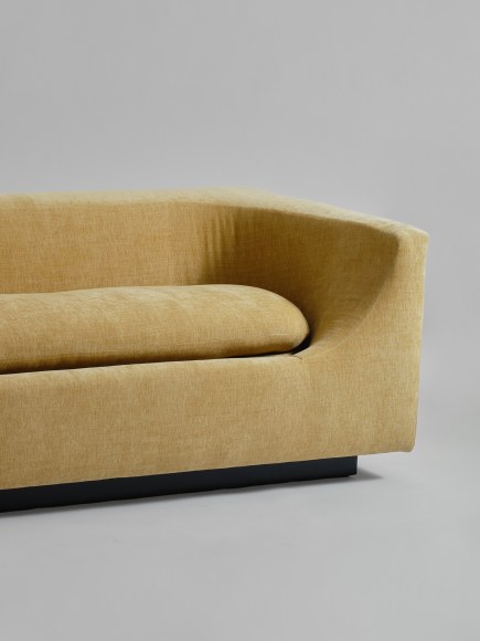 gold sofa in a gray room