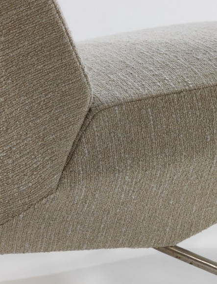 Detail of upholstered seats that can be broken into individual chairs with detachable arms