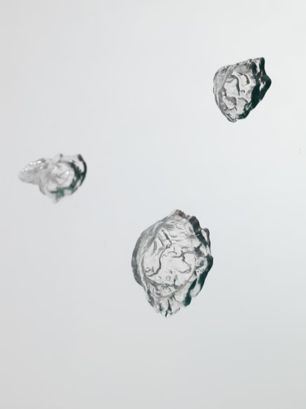 photos of a glass panel with a steel base