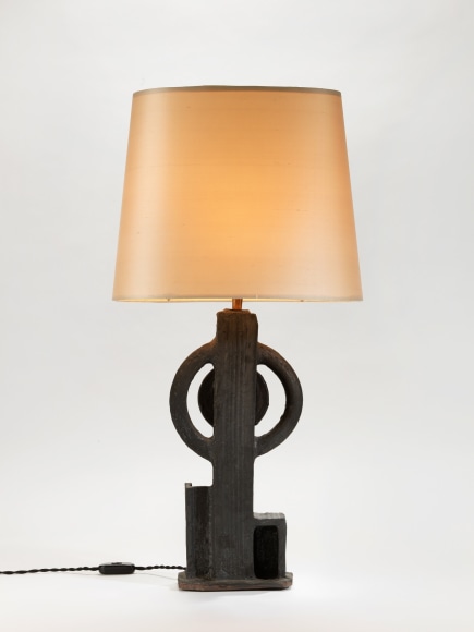 photograph of a geometric lamp in an empty room