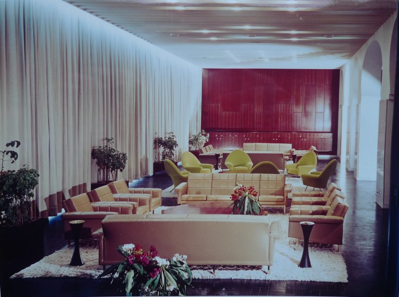 Archival photo of a large space with various seating areas featuring pieces by Joseph-Andr&eacute; Motte