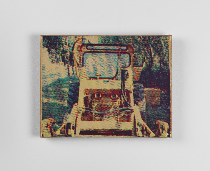 photo of a bulldozer painting on a white wall