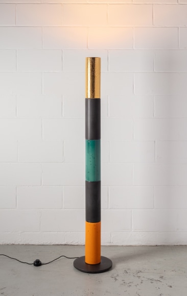 Illuminated floor lamp with orange, black, green, and gold raku glaze