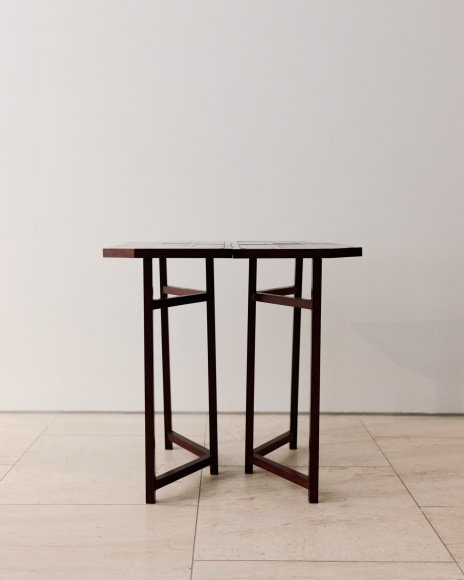 Image of wooden and glass console table in a geometric pattern from base and top by Pierre Paulin.