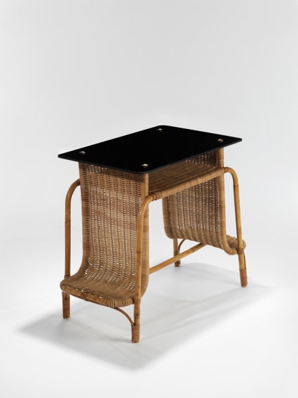 rattan desk in an empty room