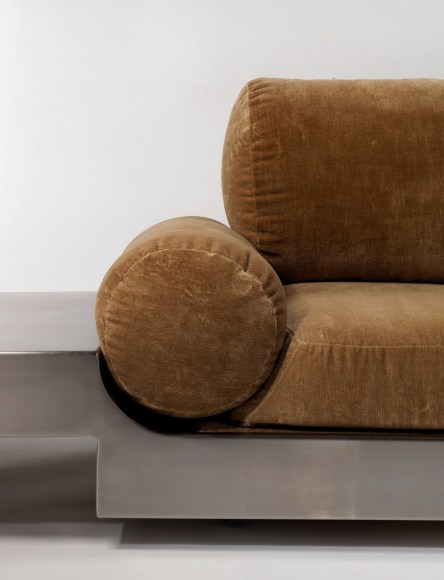 Detail close up of Maria pergay daybed with brown upholstery and steel frame.