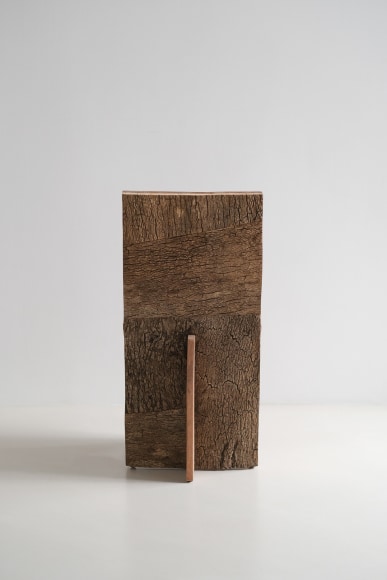 wood and cork chair with angled back shown in every angle against a grey background.