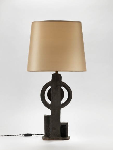 photograph of a geometric lamp in an empty room