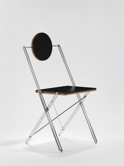 Black lacquered chair with tubular steel leg frame