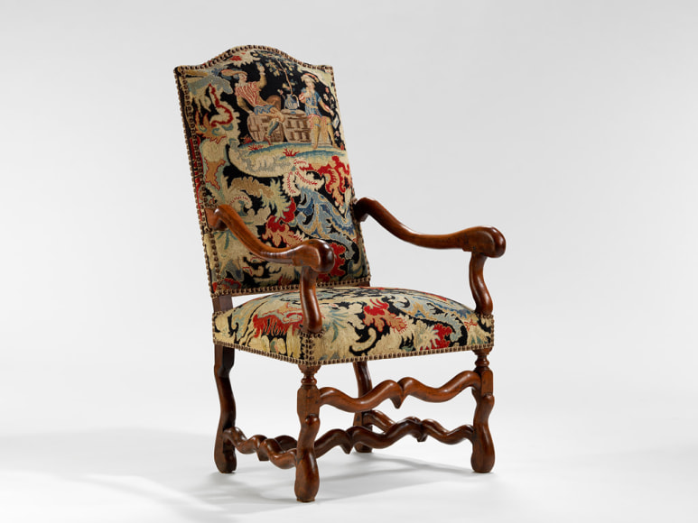 picture of a antique chair in a gray room