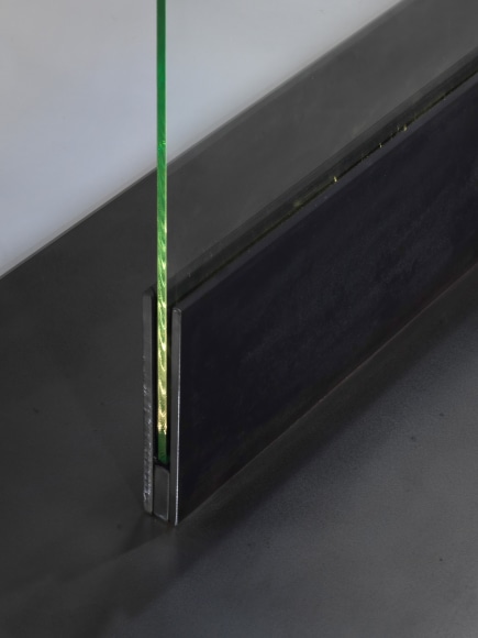 photos of a glass panel with a steel base