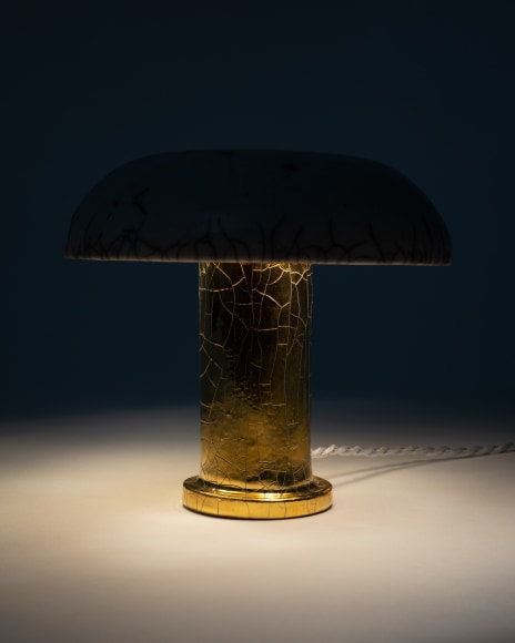 Illuminated lamp with white raku glazed shade and gold raku glazed base