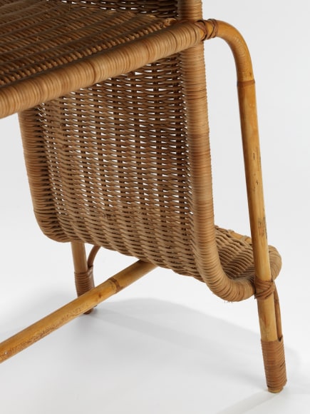 rattan desk in an empty room