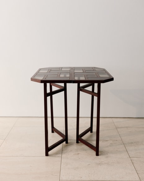 Image of wooden and glass console table in a geometric pattern from base and top by Pierre Paulin.