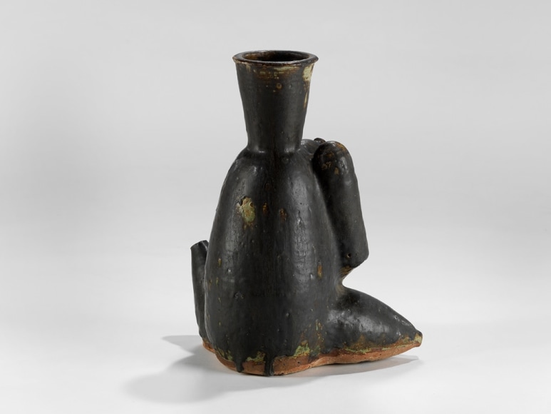 picture of a ceramic sculpture in a grey room