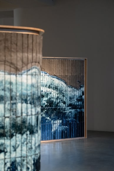 Image of Azulejos panels by Noe Mis in a room with details of ceramic and blue tiles.