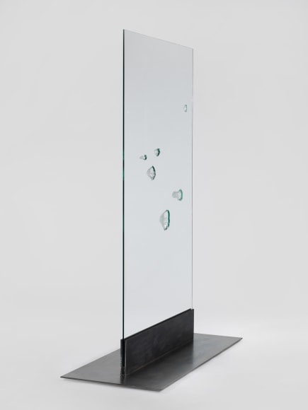 photos of a glass panel with a steel base