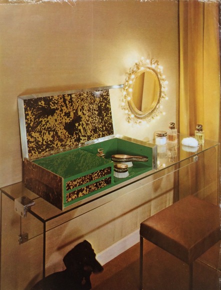 Image of the vanity with a poodle underneath the vanity in an apartment.